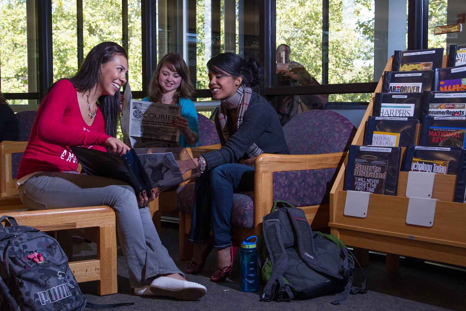 students in the library lounge area